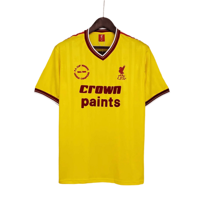https://cdn.shopify.com/s/files/1/0826/7228/8075/files/19851986-liverpool-crown-paints-yellow-third-retro-kit-classickits433-712724.webp?v=1741197841