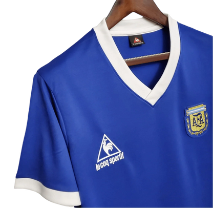 https://cdn.shopify.com/s/files/1/0826/7228/8075/files/1986-argentina-world-cup-away-retro-jersey-350341.webp?v=1741198513