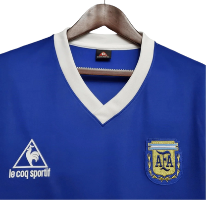 https://cdn.shopify.com/s/files/1/0826/7228/8075/files/1986-argentina-world-cup-away-retro-jersey-509297.webp?v=1741198513