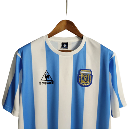 https://cdn.shopify.com/s/files/1/0826/7228/8075/files/1986-argentina-world-cup-home-retro-kit-classickits433-753373.webp?v=1741198801