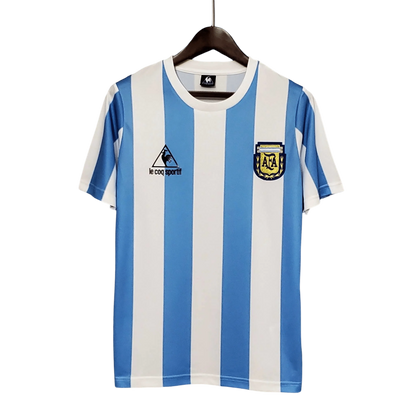 https://cdn.shopify.com/s/files/1/0826/7228/8075/files/1986-argentina-world-cup-home-retro-kit-classickits433-828673.webp?v=1741198800