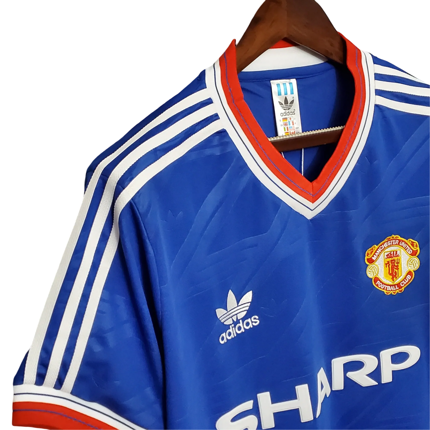 https://cdn.shopify.com/s/files/1/0826/7228/8075/files/19861988-manchester-united-sharp-away-retro-kit-classickits433-480559.webp?v=1741197674