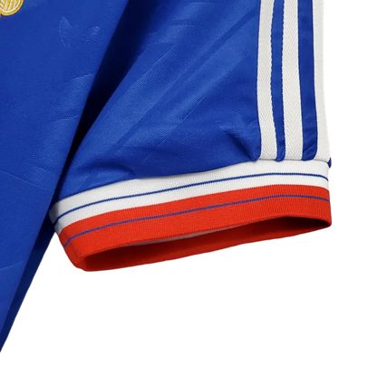 https://cdn.shopify.com/s/files/1/0826/7228/8075/files/19861988-manchester-united-sharp-blue-third-retro-kit-classickits433-591654.webp?v=1741199165