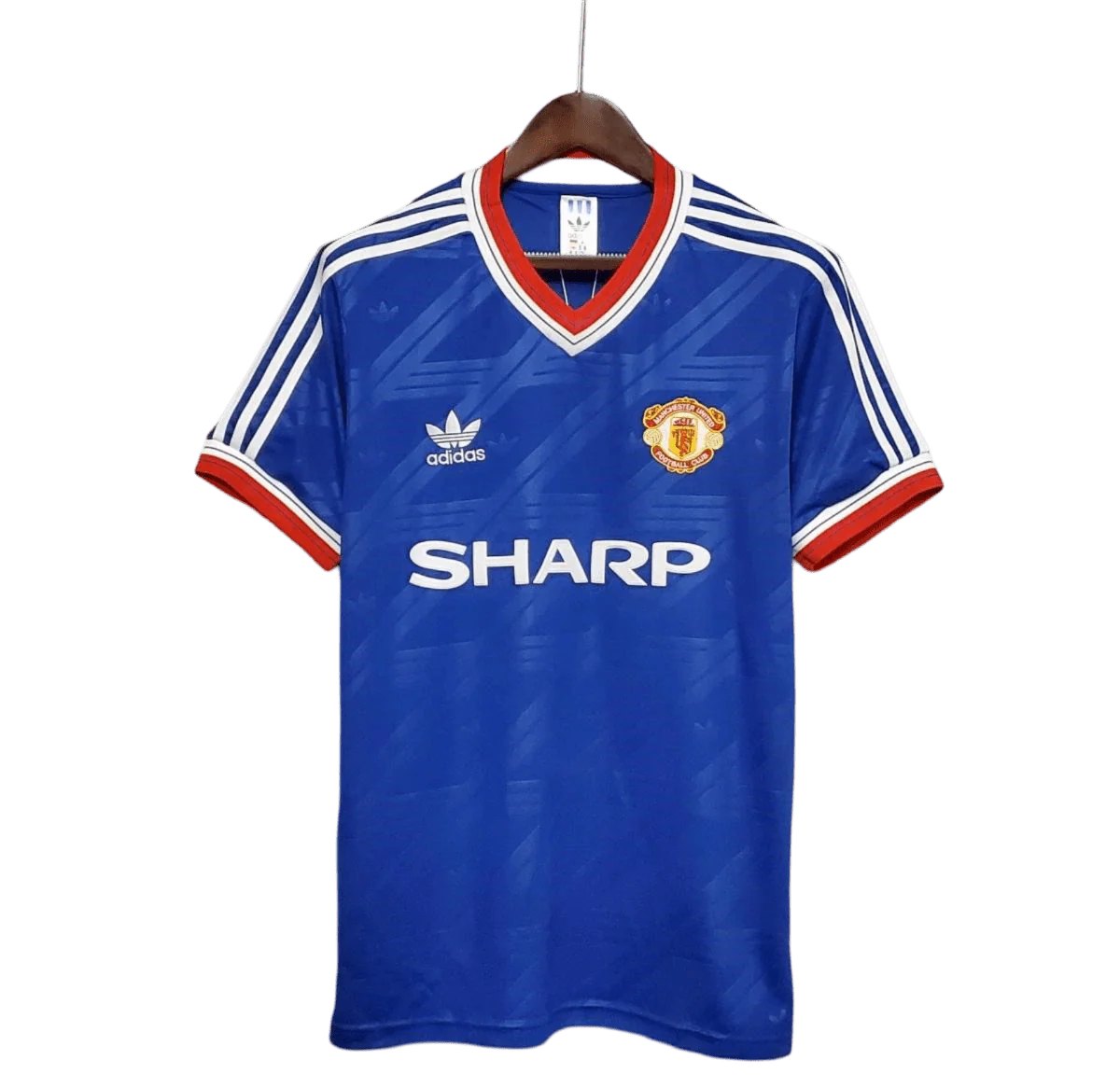 https://cdn.shopify.com/s/files/1/0826/7228/8075/files/19861988-manchester-united-sharp-blue-third-retro-kit-classickits433-660766.webp?v=1741199165