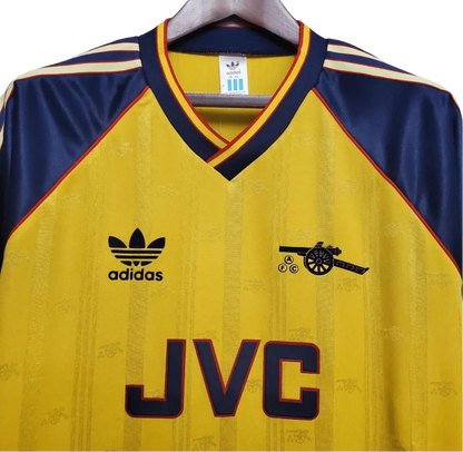 https://cdn.shopify.com/s/files/1/0826/7228/8075/files/19881989-arsenal-jvc-yellow-away-retro-kit-classickits433-390996.webp?v=1741199333