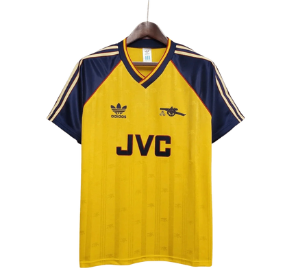 https://cdn.shopify.com/s/files/1/0826/7228/8075/files/19881989-arsenal-jvc-yellow-away-retro-kit-classickits433-632868.webp?v=1741199335