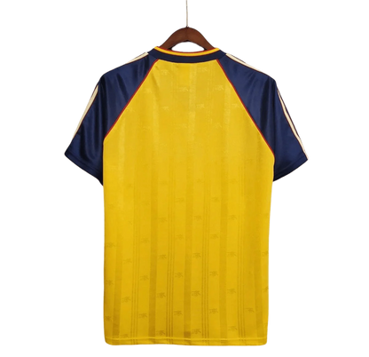 https://cdn.shopify.com/s/files/1/0826/7228/8075/files/19881989-arsenal-jvc-yellow-away-retro-kit-classickits433-776962.webp?v=1741199334