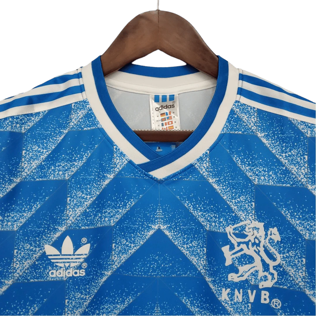 https://cdn.shopify.com/s/files/1/0826/7228/8075/files/19881989-netherlands-euro-away-retro-kit-classickits433-588334.webp?v=1741198792