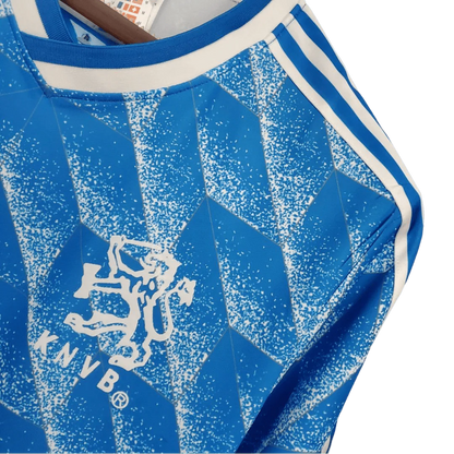 https://cdn.shopify.com/s/files/1/0826/7228/8075/files/19881989-netherlands-euro-away-retro-kit-classickits433-946128.webp?v=1741198792