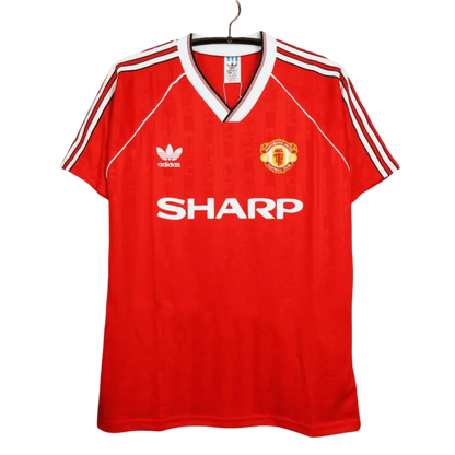 https://cdn.shopify.com/s/files/1/0826/7228/8075/files/19881990-manchester-united-sharp-home-retro-kit-classickits433-998198.webp?v=1741197622