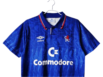 https://cdn.shopify.com/s/files/1/0826/7228/8075/files/19891991-chelsea-commodore-home-retro-kit-classickits433-958874.webp?v=1741199192