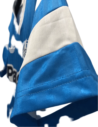 https://cdn.shopify.com/s/files/1/0826/7228/8075/files/19901991-olympique-de-marseille-panasonic-away-retro-jersey-426088.webp?v=1741199414