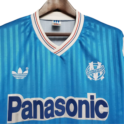 https://cdn.shopify.com/s/files/1/0826/7228/8075/files/19901991-olympique-de-marseille-panasonic-away-retro-jersey-614636.webp?v=1741199415