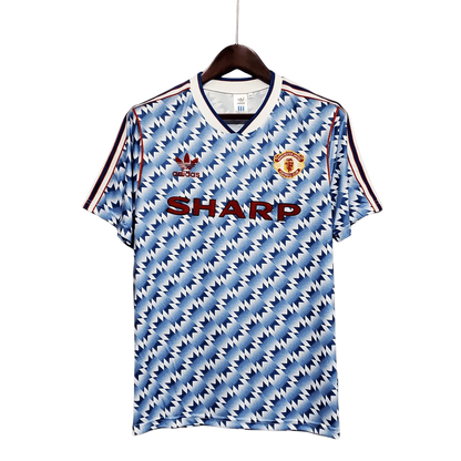 https://cdn.shopify.com/s/files/1/0826/7228/8075/files/19901992-manchester-united-sharp-blue-flower-away-retro-kit-classickits433-718225.webp?v=1741197760