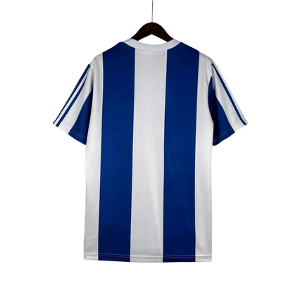 https://cdn.shopify.com/s/files/1/0826/7228/8075/files/19901993-fc-porto-revigres-away-retro-jersey-865502.webp?v=1741199358