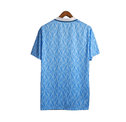 https://cdn.shopify.com/s/files/1/0826/7228/8075/files/19911992-lazio-banco-santo-spirito-home-retro-kit-classickits433-345751.webp?v=1741199022