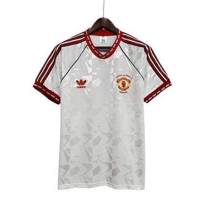 https://cdn.shopify.com/s/files/1/0826/7228/8075/files/19911992-manchester-united-white-third-retro-kit-classickits433-494801.webp?v=1741199137