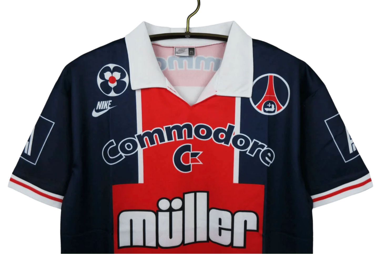 https://cdn.shopify.com/s/files/1/0826/7228/8075/files/19911992-paris-saint-germain-commodore-muller-home-retro-jersey-at-govintagejersey-432501.webp?v=1741199407