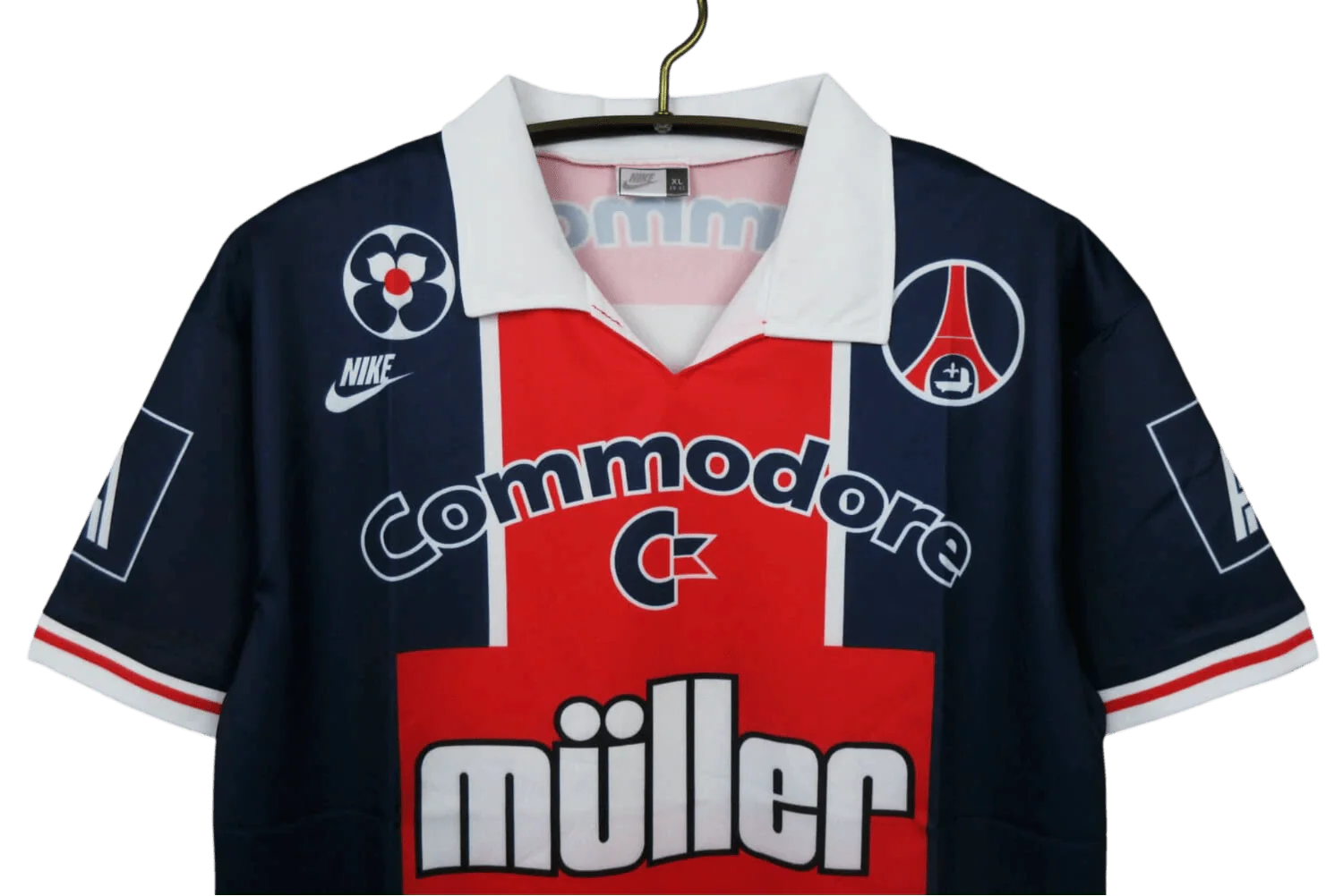 https://cdn.shopify.com/s/files/1/0826/7228/8075/files/19911992-paris-saint-germain-commodore-muller-home-retro-jersey-at-govintagejersey-432501.webp?v=1741199407