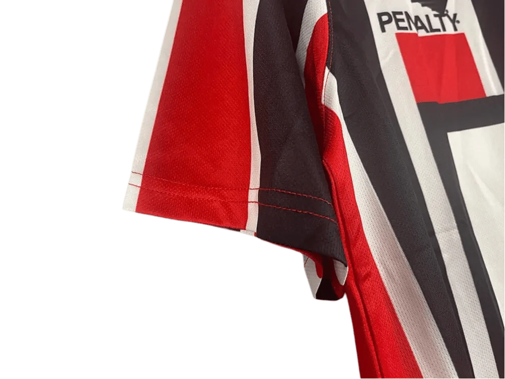 https://cdn.shopify.com/s/files/1/0826/7228/8075/files/19911992-sao-paulo-ibf-formularios-away-retro-jersey-251720.webp?v=1741197155