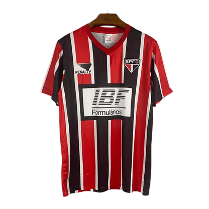 https://cdn.shopify.com/s/files/1/0826/7228/8075/files/19911992-sao-paulo-ibf-formularios-away-retro-jersey-340968.webp?v=1741197153