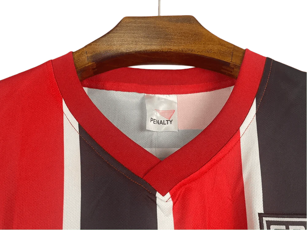 https://cdn.shopify.com/s/files/1/0826/7228/8075/files/19911992-sao-paulo-ibf-formularios-away-retro-jersey-444670.webp?v=1741197156