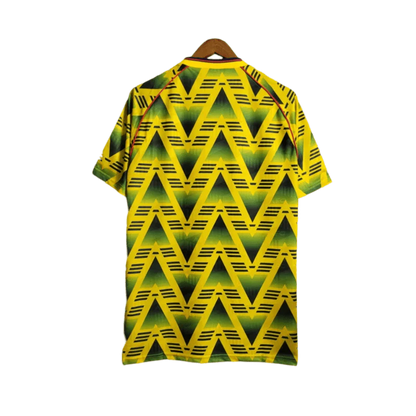 https://cdn.shopify.com/s/files/1/0826/7228/8075/files/19911993-arsenal-jvc-bruised-banana-away-retro-kit-classickits433-997688.webp?v=1741199347