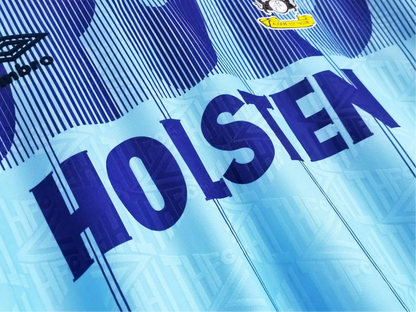 https://cdn.shopify.com/s/files/1/0826/7228/8075/files/19921994-tottenham-hotspur-holsten-blue-third-retro-kit-classickits433-882894.webp?v=1741198009