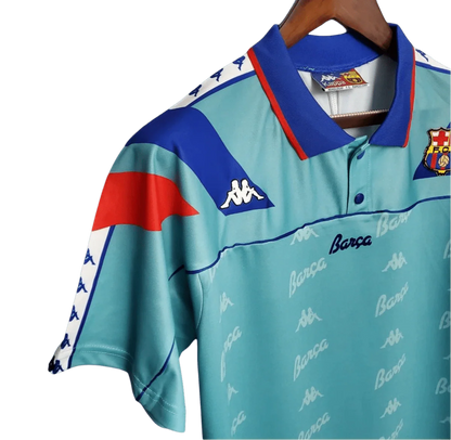 https://cdn.shopify.com/s/files/1/0826/7228/8075/files/19921995-fc-barcelona-turquoise-away-retro-kit-classickits433-746578.webp?v=1741199030