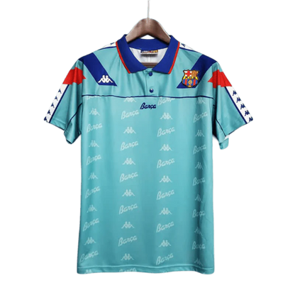 https://cdn.shopify.com/s/files/1/0826/7228/8075/files/19921995-fc-barcelona-turquoise-away-retro-kit-classickits433-790892.webp?v=1741199030