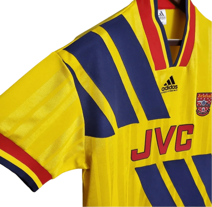 https://cdn.shopify.com/s/files/1/0826/7228/8075/files/19931994-arsenal-jvc-yellow-away-retro-kit-classickits433-892825.webp?v=1741199343