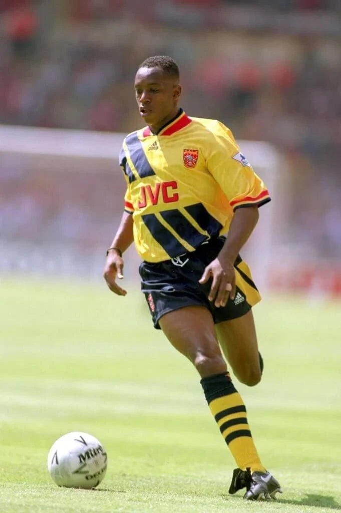 https://cdn.shopify.com/s/files/1/0826/7228/8075/files/19931994-arsenal-jvc-yellow-away-retro-kit-classickits433-985539.webp?v=1741199344