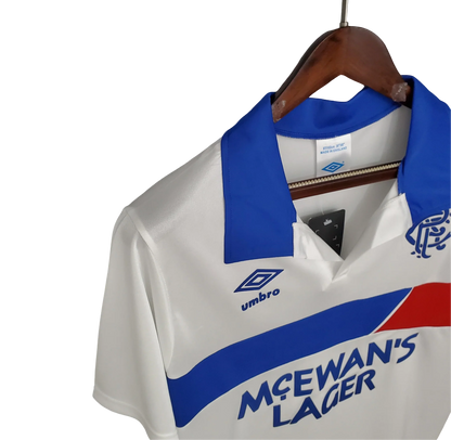 https://cdn.shopify.com/s/files/1/0826/7228/8075/files/19931994-glasgow-rangers-mcewans-lager-away-kit-classickits433-938596.webp?v=1741199135