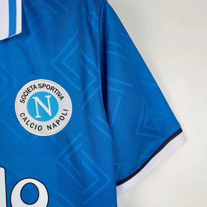 https://cdn.shopify.com/s/files/1/0826/7228/8075/files/19931994-napoli-maradona-shirt-voiello-home-retro-kit-258053.webp?v=1741198900