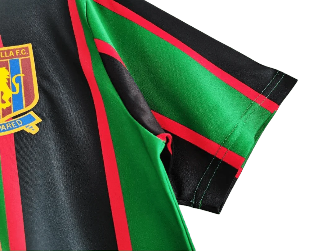 https://cdn.shopify.com/s/files/1/0826/7228/8075/files/19931995-aston-villa-muller-green-black-away-retro-kit-classickits433-735542.webp?v=1741199253