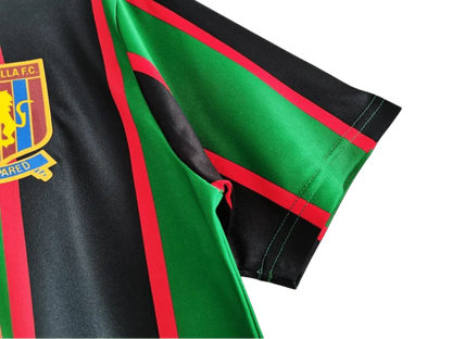 https://cdn.shopify.com/s/files/1/0826/7228/8075/files/19931995-aston-villa-muller-green-black-away-retro-kit-classickits433-735542.webp?v=1741199253