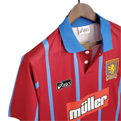 https://cdn.shopify.com/s/files/1/0826/7228/8075/files/19931995-aston-villa-muller-home-retro-kit-classickits433-288489.webp?v=1741199263