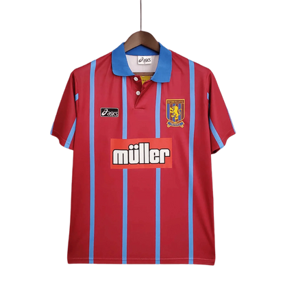 https://cdn.shopify.com/s/files/1/0826/7228/8075/files/19931995-aston-villa-muller-home-retro-kit-classickits433-940719.webp?v=1741199261