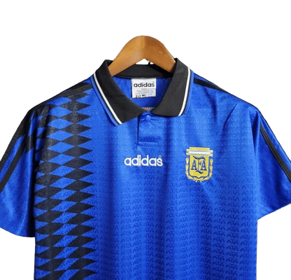 https://cdn.shopify.com/s/files/1/0826/7228/8075/files/1994-argentina-world-cup-away-retro-kit-classickits433-926551.webp?v=1741198808