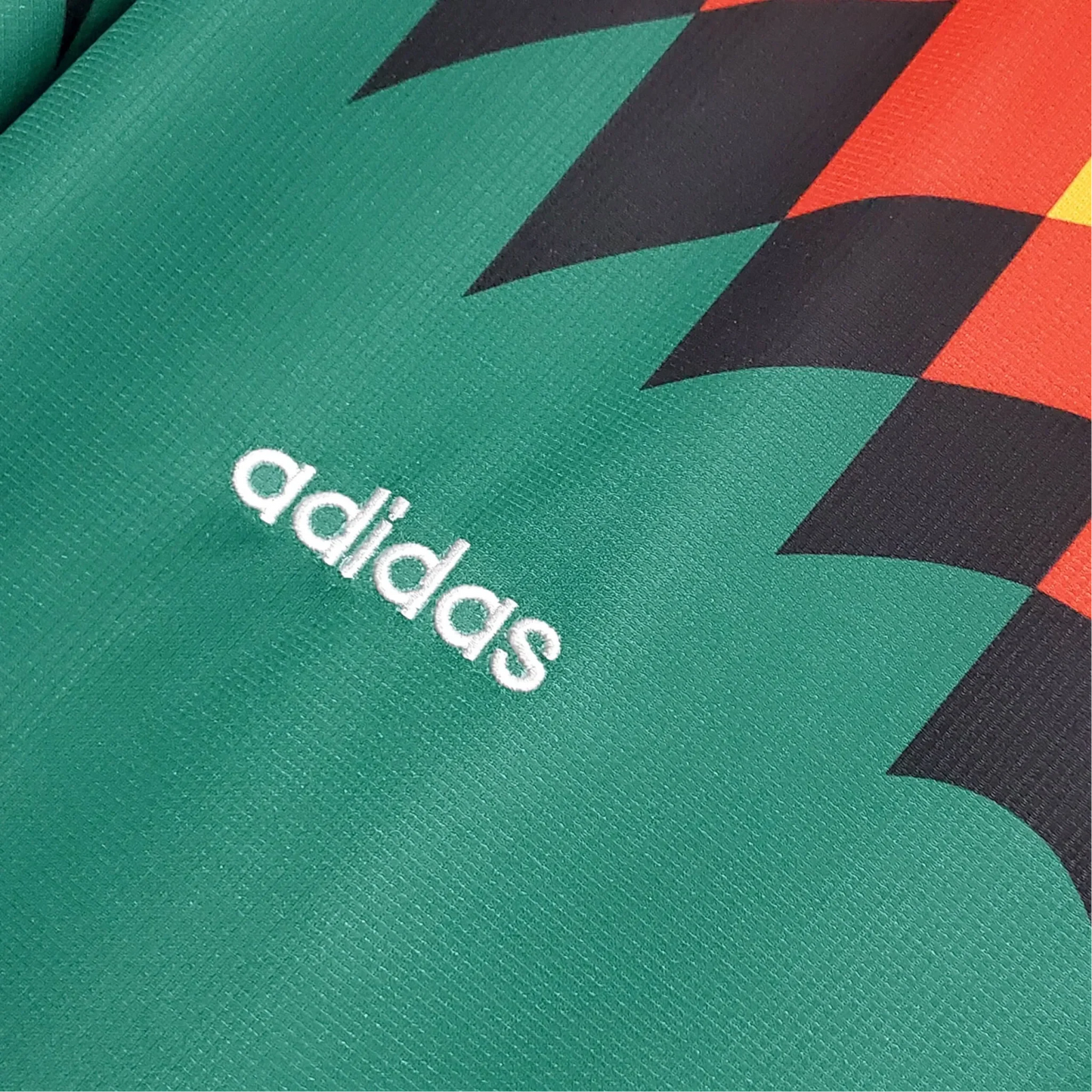 https://cdn.shopify.com/s/files/1/0826/7228/8075/files/1994-germany-world-cup-second-retro-kit-276784.webp?v=1741197038