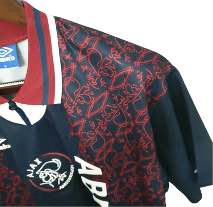 https://cdn.shopify.com/s/files/1/0826/7228/8075/files/19941995-ajax-abn-amro-away-retro-kit-classickits433-137205.webp?v=1741199358