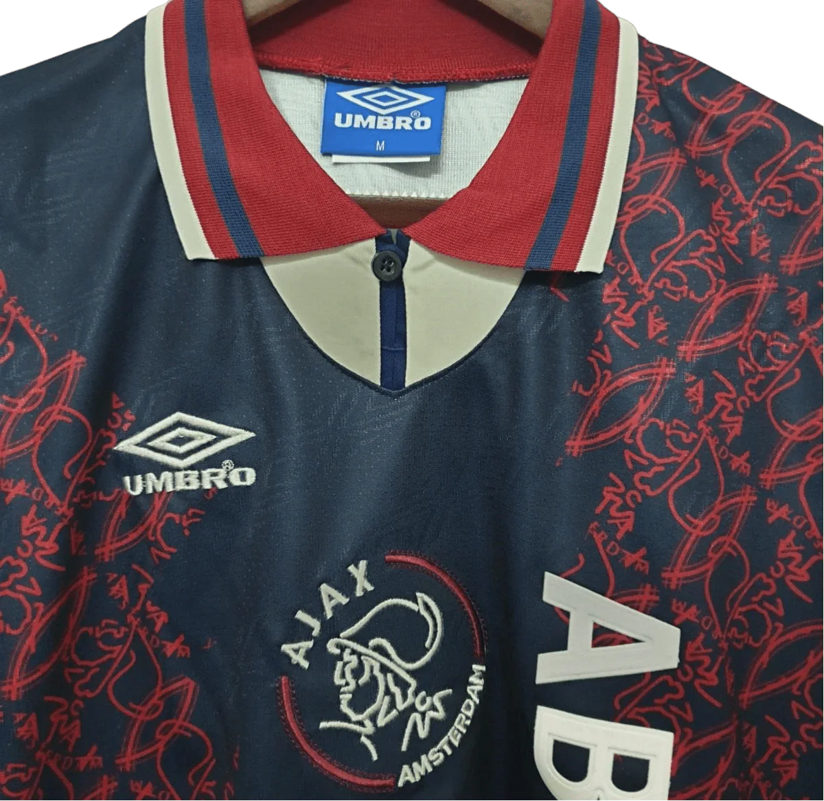 https://cdn.shopify.com/s/files/1/0826/7228/8075/files/19941995-ajax-abn-amro-away-retro-kit-classickits433-283126.webp?v=1741199361