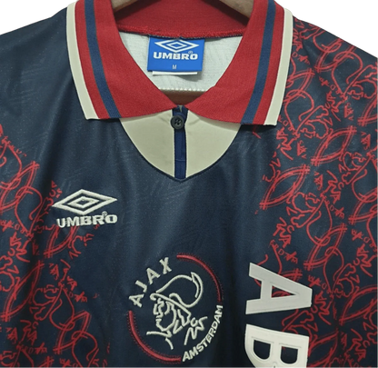 https://cdn.shopify.com/s/files/1/0826/7228/8075/files/19941995-ajax-abn-amro-away-retro-kit-classickits433-283126.webp?v=1741199361