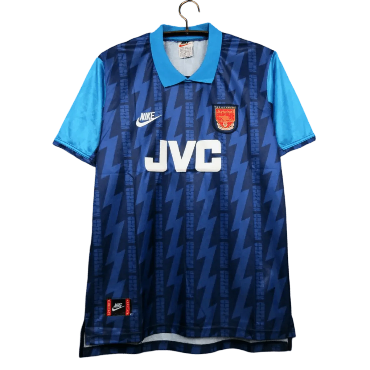 https://cdn.shopify.com/s/files/1/0826/7228/8075/files/19941995-arsenal-jvc-blue-away-retro-kit-classickits433-448433.webp?v=1741198352