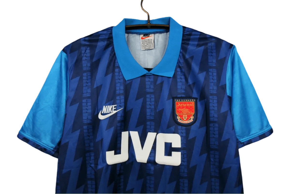 https://cdn.shopify.com/s/files/1/0826/7228/8075/files/19941995-arsenal-jvc-blue-away-retro-kit-classickits433-453160.webp?v=1741198354
