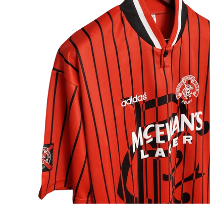 https://cdn.shopify.com/s/files/1/0826/7228/8075/files/19941995-glasgow-rangers-mcewans-lager-away-kit-classickits433-191150.webp?v=1741199134
