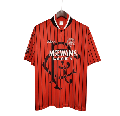 https://cdn.shopify.com/s/files/1/0826/7228/8075/files/19941995-glasgow-rangers-mcewans-lager-away-kit-classickits433-790293.webp?v=1741199133