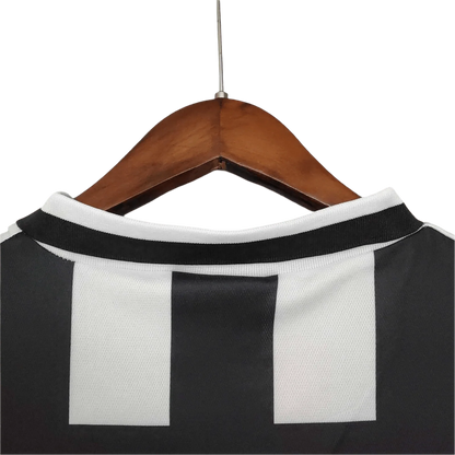 https://cdn.shopify.com/s/files/1/0826/7228/8075/files/19941995-juventus-danone-home-retro-kit-984003.webp?v=1741197287