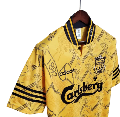 https://cdn.shopify.com/s/files/1/0826/7228/8075/files/19941995-liverpool-carlsberg-yellow-third-retro-kit-classickits433-317025.webp?v=1741199191