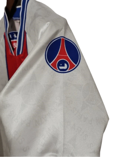 https://cdn.shopify.com/s/files/1/0826/7228/8075/files/19941995-paris-saint-germain-away-white-retro-jersey-995988.webp?v=1741199359